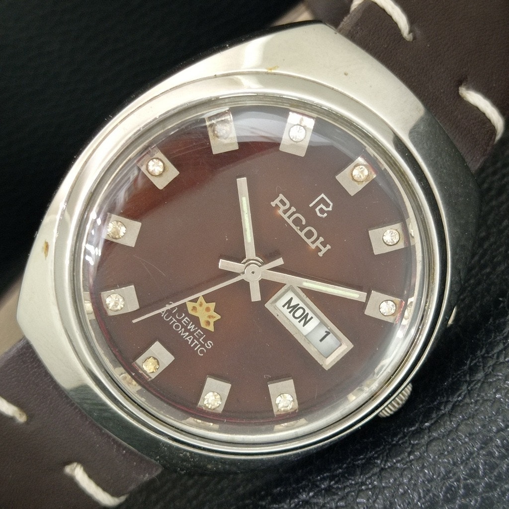 Vintage 1976 Ricoh Automatic Mens Silver Watch WDaydate  Brown Accents